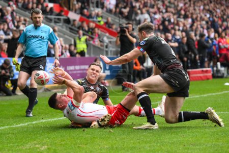 Photo for Lewis Dodd of St. Helens is tackled into touch by Jai Field of Wigan Warriors  during the Betfred Super League Round 6 match St Helens vs Wigan Warriors at Totally Wicked Stadium, St Helens, United Kingdom, 29th March 202 - Royalty Free Image