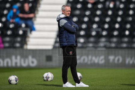 Photo for Neil Critchley manager of Blackpool during the pre-game warm up ahead of the Sky Bet League 1 match Derby County vs Blackpool at Pride Park Stadium, Derby, United Kingdom, 29th March 202 - Royalty Free Image