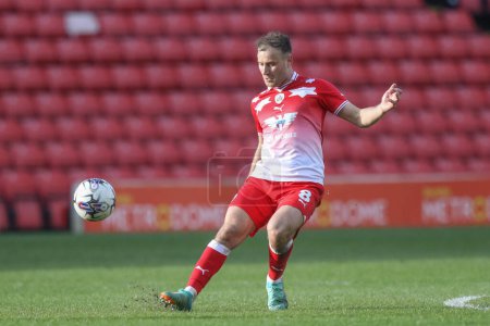 Photo for Herbie Kane of Barnsley crosses the ball during the Sky Bet League 1 match Barnsley vs Cambridge United at Oakwell, Barnsley, United Kingdom, 29th March 202 - Royalty Free Image