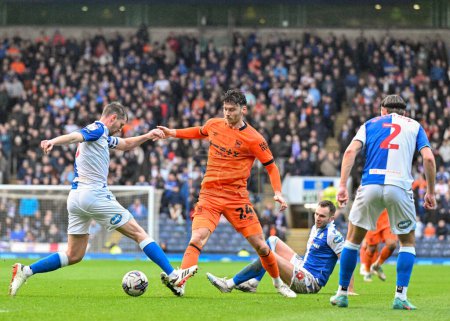 Photo for Scott Wharton of Blackburn Rovers  and Kieffer Moore of Ipswich Town battle for the ball, during the Sky Bet Championship match Blackburn Rovers vs Ipswich Town at Ewood Park, Blackburn, United Kingdom, 29th March 202 - Royalty Free Image