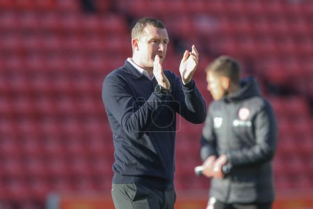 Photo for Neill Collins Head coach of Barnsley applauds the home fans after the game during the Sky Bet League 1 match Barnsley vs Cambridge United at Oakwell, Barnsley, United Kingdom, 29th March 202 - Royalty Free Image