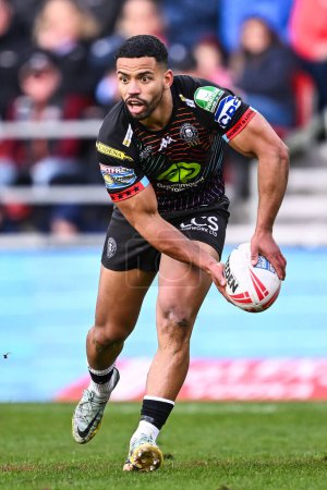 Photo for Kruise Leeming of Wigan Warriors makes a break during the Betfred Super League Round 6 match St Helens vs Wigan Warriors at Totally Wicked Stadium, St Helens, United Kingdom, 29th March 202 - Royalty Free Image