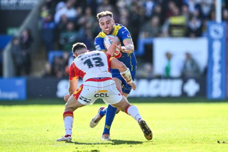 Photo for James Harrison of Warrington Wolves is tackled by Ben Garcia of Catalan Dragons during the Betfred Super League match Warrington Wolves vs Catalans Dragons at Halliwell Jones Stadium, Warrington, United Kingdom, 30th March 202 - Royalty Free Image