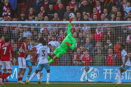 Photo for Dean Henderson of Crystal Palace makes a fingertip save during the Premier League match Nottingham Forest vs Crystal Palace at City Ground, Nottingham, United Kingdom, 30th March 202 - Royalty Free Image