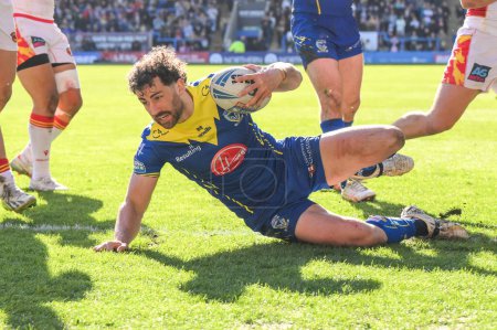 Photo for Toby King of Warrington Wolves goes over for a tryduring the Betfred Super League match Warrington Wolves vs Catalans Dragons at Halliwell Jones Stadium, Warrington, United Kingdom, 30th March 202 - Royalty Free Image