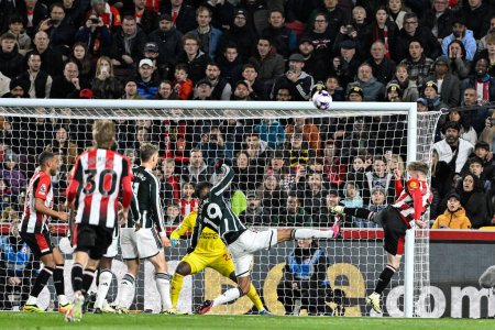 Photo for Keane Lewis-Potter of Brentfordtakes a shot on goal during the Premier League match Brentford vs Manchester United at The Gtech Community Stadium, London, United Kingdom, 30th March 202 - Royalty Free Image