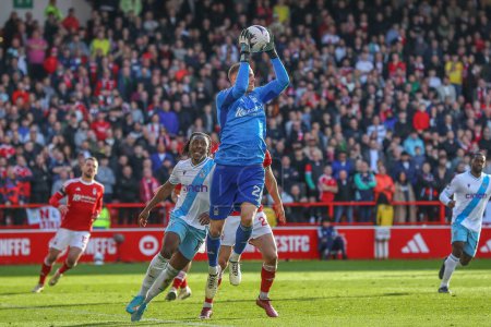 Photo for Matz Sels of Nottingham Forest catches the ball during the Premier League match Nottingham Forest vs Crystal Palace at City Ground, Nottingham, United Kingdom, 30th March 202 - Royalty Free Image