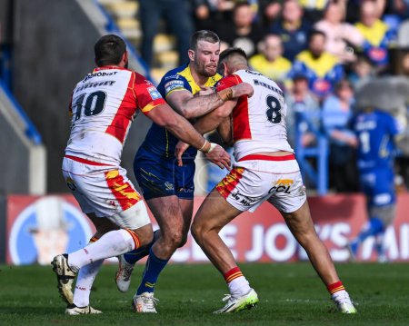 Photo for Lachlan Fitzgibbon of Warrington Wolves is tackled by Mike McMeeken of Catalan Dragons during the Betfred Super League match Warrington Wolves vs Catalans Dragons at Halliwell Jones Stadium, Warrington, United Kingdom, 30th March 202 - Royalty Free Image