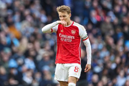 Photo for Martin degaard of Arsenal during the Premier League match Manchester City vs Arsenal at Etihad Stadium, Manchester, United Kingdom, 31st March 2024 - Royalty Free Image
