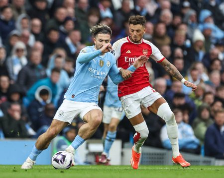 Photo for Jack Grealish of Manchester City and Ben White of Arsenal battle for the ball during the Premier League match Manchester City vs Arsenal at Etihad Stadium, Manchester, United Kingdom, 31st March 202 - Royalty Free Image