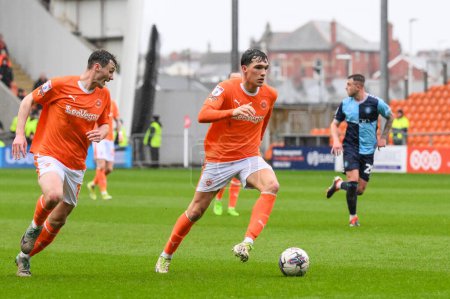 Photo for Kyle Joseph of Blackpool makes a break with the ball during the Sky Bet League 1 match Blackpool vs Wycombe Wanderers at Bloomfield Road, Blackpool, United Kingdom, 1st April 202 - Royalty Free Image