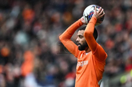 Photo for CJ Hamilton of Blackpool takes a throw in during the Sky Bet League 1 match Blackpool vs Wycombe Wanderers at Bloomfield Road, Blackpool, United Kingdom, 1st April 202 - Royalty Free Image