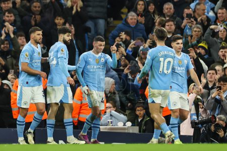 Photo for Phil Foden of Manchester City celebrates his goal to make it 3-1 during the Premier League match Manchester City vs Aston Villa at Etihad Stadium, Manchester, United Kingdom, 3rd April 202 - Royalty Free Image
