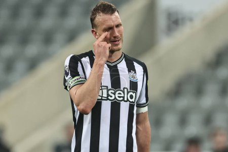 Photo for A dejected Dan Burn of Newcastle United after they draw 1-1 during the Premier League match Newcastle United vs Everton at St. James's Park, Newcastle, United Kingdom, 2nd April 202 - Royalty Free Image