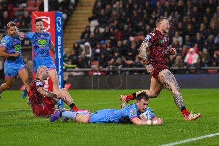 Photo for Harry Smith of Wigan Warriors goes over for a try during the Betfred Super League Round 7 match Leigh Leopards vs Wigan Warriors at Leigh Sports Village, Leigh, United Kingdom, 4th April 202 - Royalty Free Image