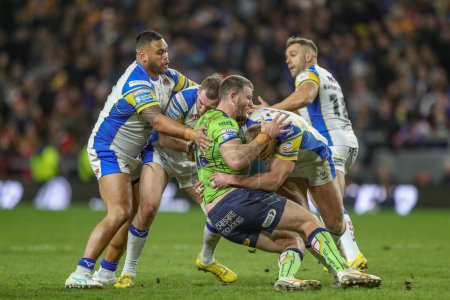Photo for Lachlan Fitzgibbon of Warrington Wolves is tackled by Cameron Smith of Leeds Rhinos during the Betfred Super League Round 7 match Leeds Rhinos vs Warrington Wolves at Headingley Stadium, Leeds, United Kingdom, 5th April 202 - Royalty Free Image