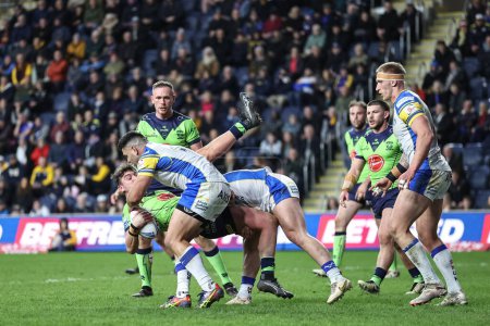 Photo for Jordan Crowther of Warrington Wolves is tackled by Rhyse Martin of Leeds Rhinos during the Betfred Super League Round 7 match Leeds Rhinos vs Warrington Wolves at Headingley Stadium, Leeds, United Kingdom, 5th April 202 - Royalty Free Image
