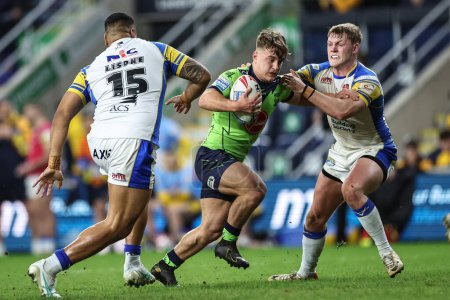 Photo for Leon Hayes of Warrington Wolves goes over for a try to make it James McDonnell of Leeds Rhinos during the Betfred Super League Round 7 match Leeds Rhinos vs Warrington Wolves at Headingley Stadium, Leeds, United Kingdom, 5th April 202 - Royalty Free Image