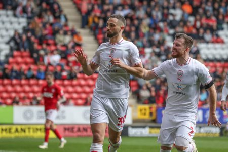 Photo for Adam Phillips of Barnsley celebrates his goal to make it 1-1 during the Sky Bet League 1 match Charlton Athletic vs Barnsley at The Valley, London, United Kingdom, 6th April 202 - Royalty Free Image