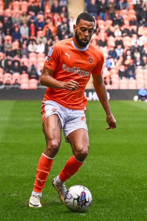 Photo for CJ Hamilton of Blackpool makes a break with the ball during the Sky Bet League 1 match Blackpool vs Cambridge United at Bloomfield Road, Blackpool, United Kingdom, 6th April 202 - Royalty Free Image