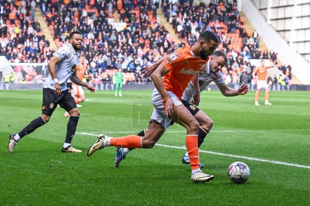 Photo for CJ Hamilton of Blackpool makes a break with the ball during the Sky Bet League 1 match Blackpool vs Cambridge United at Bloomfield Road, Blackpool, United Kingdom, 6th April 202 - Royalty Free Image