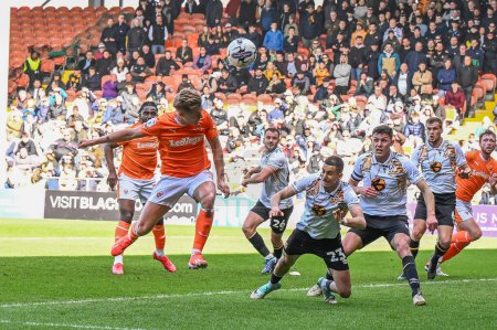 Photo for George Byers of Blackpool flicks the ball on from a corner during the Sky Bet League 1 match Blackpool vs Cambridge United at Bloomfield Road, Blackpool, United Kingdom, 6th April 202 - Royalty Free Image