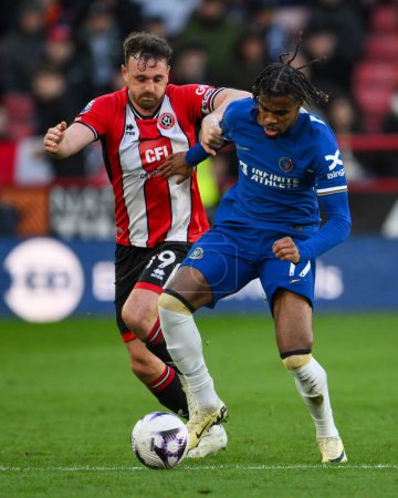 Photo for Carney Chukwuemeka of Chelsea and Jack Robinson of Sheffield United battle for the ball during the Premier League match Sheffield United vs Chelsea at Bramall Lane, Sheffield, United Kingdom, 7th April 202 - Royalty Free Image