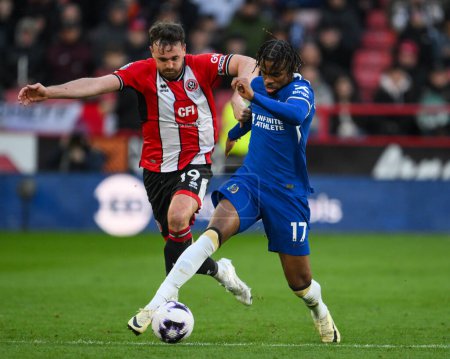 Photo for Carney Chukwuemeka of Chelsea and Jack Robinson of Sheffield United battle for the ball during the Premier League match Sheffield United vs Chelsea at Bramall Lane, Sheffield, United Kingdom, 7th April 2024 - Royalty Free Image