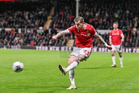Photo for James McClean of Wrexham crosses the ball, during the Sky Bet League 2 match Wrexham vs Crawley Town at SToK Cae Ras, Wrexham, United Kingdom, 9th April 202 - Royalty Free Image