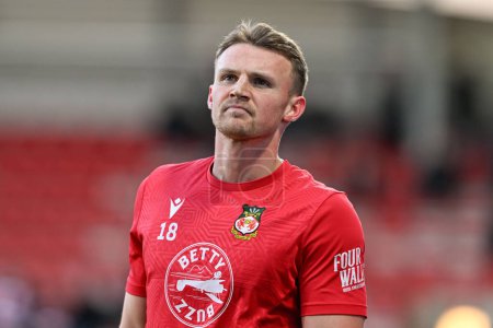 Photo for Sam Dalby of Wrexham warms up ahead of the match, during the Sky Bet League 2 match Wrexham vs Crawley Town at SToK Cae Ras, Wrexham, United Kingdom, 9th April 202 - Royalty Free Image