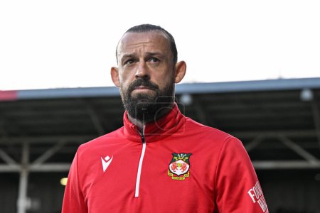 Photo for Steven Fletcher of Wrexham walks towards the bench ahead of the match, during the Sky Bet League 2 match Wrexham vs Crawley Town at SToK Cae Ras, Wrexham, United Kingdom, 9th April 202 - Royalty Free Image