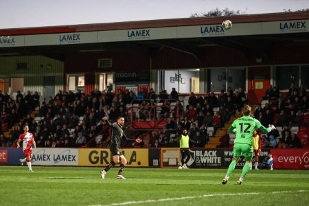 Photo for Adam Phillips of Barnsley lobs Craig MacGillivray of Stevenage to score a goal and make it 0-1 during the Sky Bet League 1 match Stevenage vs Barnsley at Lamex Stadium, Stevenage, United Kingdom, 9th April 202 - Royalty Free Image