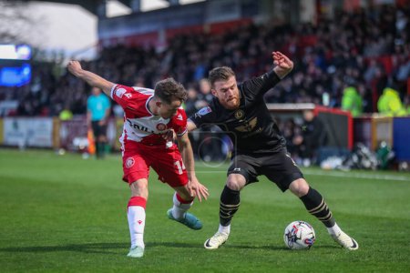Photo for Nicky Cadden of Barnsley and Kane Smith of Stevenage battle for the ball during the Sky Bet League 1 match Stevenage vs Barnsley at Lamex Stadium, Stevenage, United Kingdom, 9th April 202 - Royalty Free Image