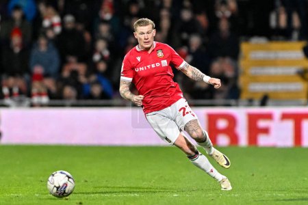 Photo for James McClean of Wrexham chases down the ball, during the Sky Bet League 2 match Wrexham vs Crawley Town at SToK Cae Ras, Wrexham, United Kingdom, 9th April 202 - Royalty Free Image