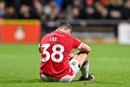 Photo for Elliot Lee of Wrexham reacts to his missed chance at goal, during the Sky Bet League 2 match Wrexham vs Crawley Town at SToK Cae Ras, Wrexham, United Kingdom, 9th April 202 - Royalty Free Image