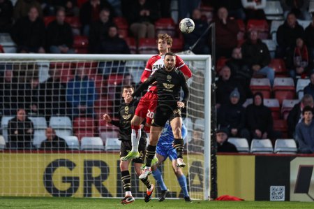 Photo for Adam Phillips of Barnsley heads the ball clear of his defensive area during the Sky Bet League 1 match Stevenage vs Barnsley at Lamex Stadium, Stevenage, United Kingdom, 9th April 202 - Royalty Free Image
