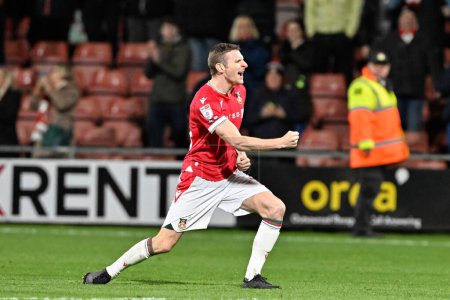 Photo for Paul Mullin of Wrexham celebrates the full time result, during the Sky Bet League 2 match Wrexham vs Crawley Town at SToK Cae Ras, Wrexham, United Kingdom, 9th April 202 - Royalty Free Image