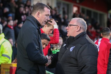 Photo for Steve Evans manager of Stevenage shakes hands with Neill Collins Head coach of Barnsley during the Sky Bet League 1 match Stevenage vs Barnsley at Lamex Stadium, Stevenage, United Kingdom, 9th April 202 - Royalty Free Image