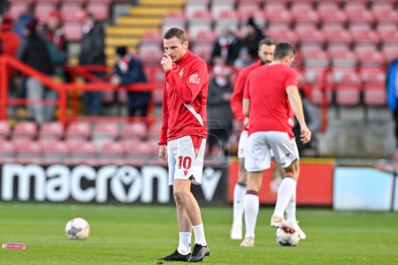 Photo for Paul Mullin of Wrexham warms up ahead of the match, during the Sky Bet League 2 match Wrexham vs Crawley Town at SToK Cae Ras, Wrexham, United Kingdom, 9th April 202 - Royalty Free Image