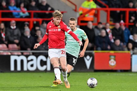 Photo for Andy Cannon of Wrexham passes the ball, during the Sky Bet League 2 match Wrexham vs Crawley Town at SToK Cae Ras, Wrexham, United Kingdom, 9th April 202 - Royalty Free Image