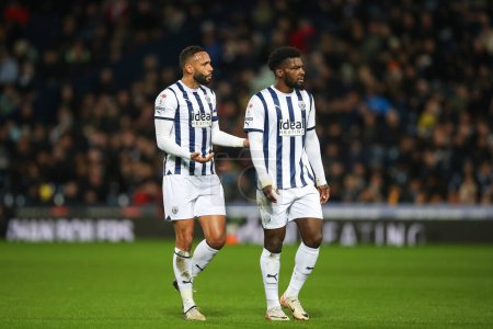 Photo for Kyle Bartley of West Bromwich Albion speaks to Cedric Kipre of West Browmich Albion, during the Sky Bet Championship match West Bromwich Albion vs Rotherham United at The Hawthorns, West Bromwich, United Kingdom, 10th April 202 - Royalty Free Image