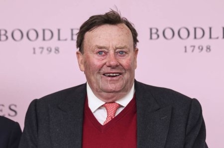 Photo for Winning trainer Nicky Henderson of Sir Gino receive the Throphy for winning the 2.20pm The Boodles Anniversary 4-y-o Juvenile Hurdle (Class 1) during the Randox Grand National 2024 Opening Day at Aintree Racecourse, Liverpool, United Kingdom, 11th Ap - Royalty Free Image