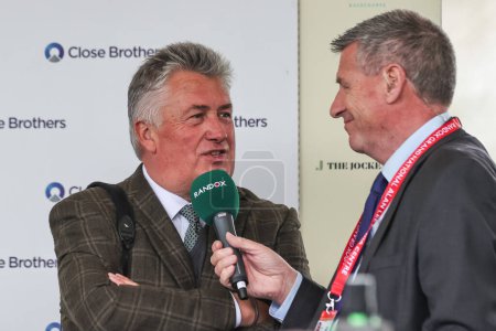 Photo for Winning trainer Paul Nicholls during a post race interview after winning the 4.40pm The Close Brothers Red Rum Handicap Steeple Chase (Class 1) during the Randox Grand National 2024 Opening Day at Aintree Racecourse, Liverpool, United Kingdom, 11th A - Royalty Free Image