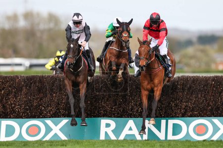 Photo for Gerri Colombe ridden by Jack Kennedy and Ahoy Senor ridden by Derek Fox battle for first place in the 2.55pmThe William Hill Bowl Steeple Chase (Class 1) during the Randox Grand National 2024 Opening Day at Aintree Racecourse, Liverpool, United Kingd - Royalty Free Image