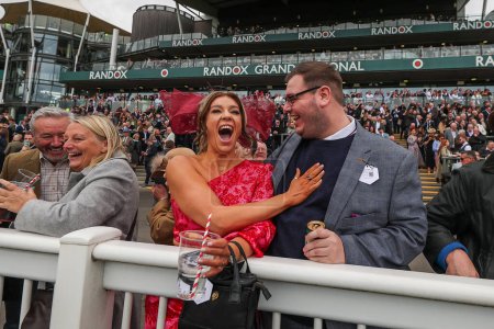 Photo for Racegoers celebrate during the Randox Grand National 2024 Opening Day at Aintree Racecourse, Liverpool, United Kingdom, 11th April 202 - Royalty Free Image