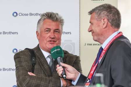Photo for Winning trainer Paul Nicholls during a post race interview after winning the 4.40pm The Close Brothers Red Rum Handicap Steeple Chase (Class 1) during the Randox Grand National 2024 Opening Day at Aintree Racecourse, Liverpool, United Kingdom, 11th A - Royalty Free Image