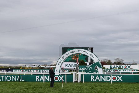 Photo for Ground staff check the video technology on the final line ahead of the Grand National Day during the Randox Grand National Day 2024 at Aintree Racecourse, Liverpool, United Kingdom, 13th April 202 - Royalty Free Image