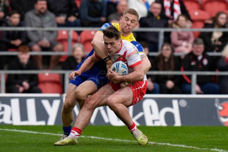 Photo for Matt Dufty of Warrington Wolves forces Jack Welsby of St. Helens over the try line during the Betfred Challenge Cup Quarter Final match St Helens vs Warrington Wolves at Totally Wicked Stadium, St Helens, United Kingdom, 14th April 202 - Royalty Free Image