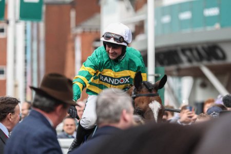 Photo for Nico De Boinville celebrates winning the 3.30pm The My Pension Expert Melling Chase (Grade 1) during the The Randox Grand National 2024 Ladies Day at Aintree Racecourse, Liverpool, United Kingdom, 12th April 202 - Royalty Free Image