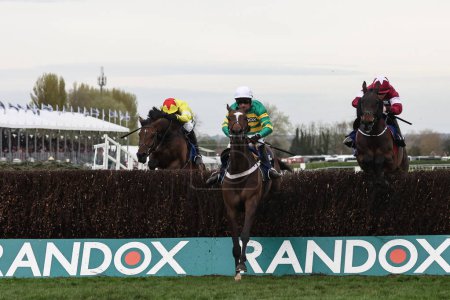 Photo for Jonbon ridden by Nico De Boinville jumps the fence during the The Randox Grand National 2024 Ladies Day at Aintree Racecourse, Liverpool, United Kingdom, 12th April 202 - Royalty Free Image